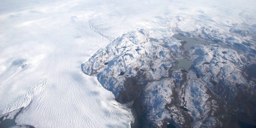 The Greenland ice sheet circumvents mountains on its way to the western coast of the great island.