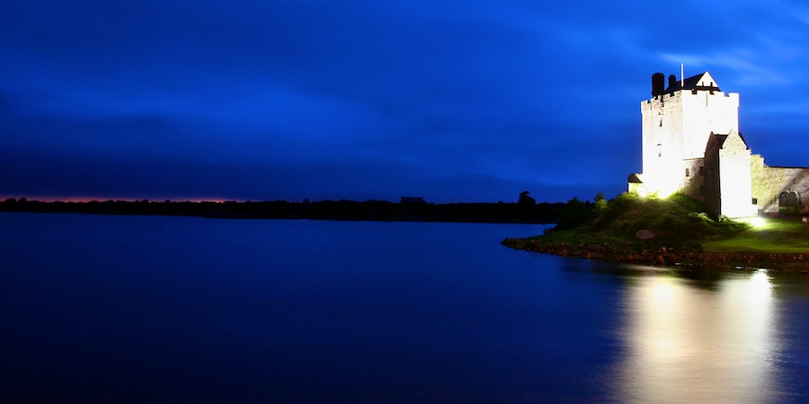 Dungaire Castle stands as a silent sentry over the Bay of Galway as dusk fades to night.